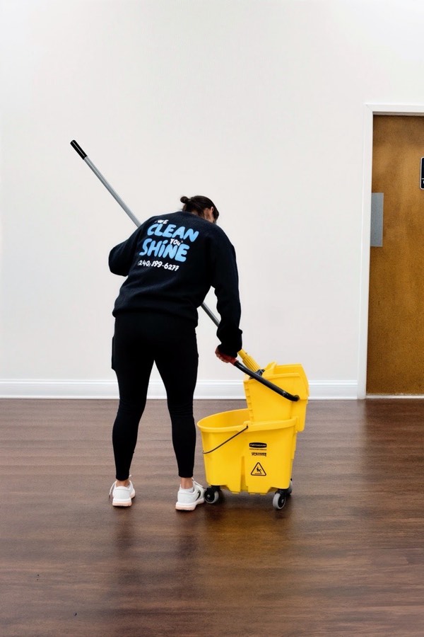 K&E team member mopping a floor